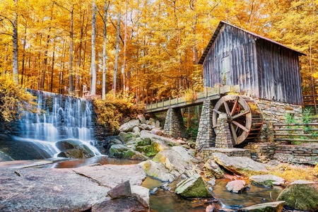 fall or autumn image of historic mill and waterfall in marietta, ga