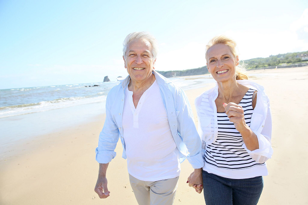 Retired Couple Walking at the Beach