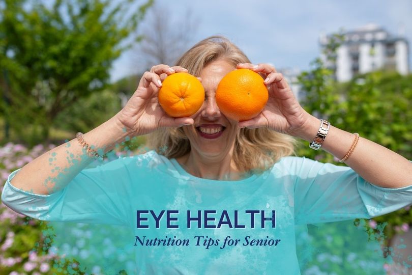 Woman Covering Eyes with Oranges