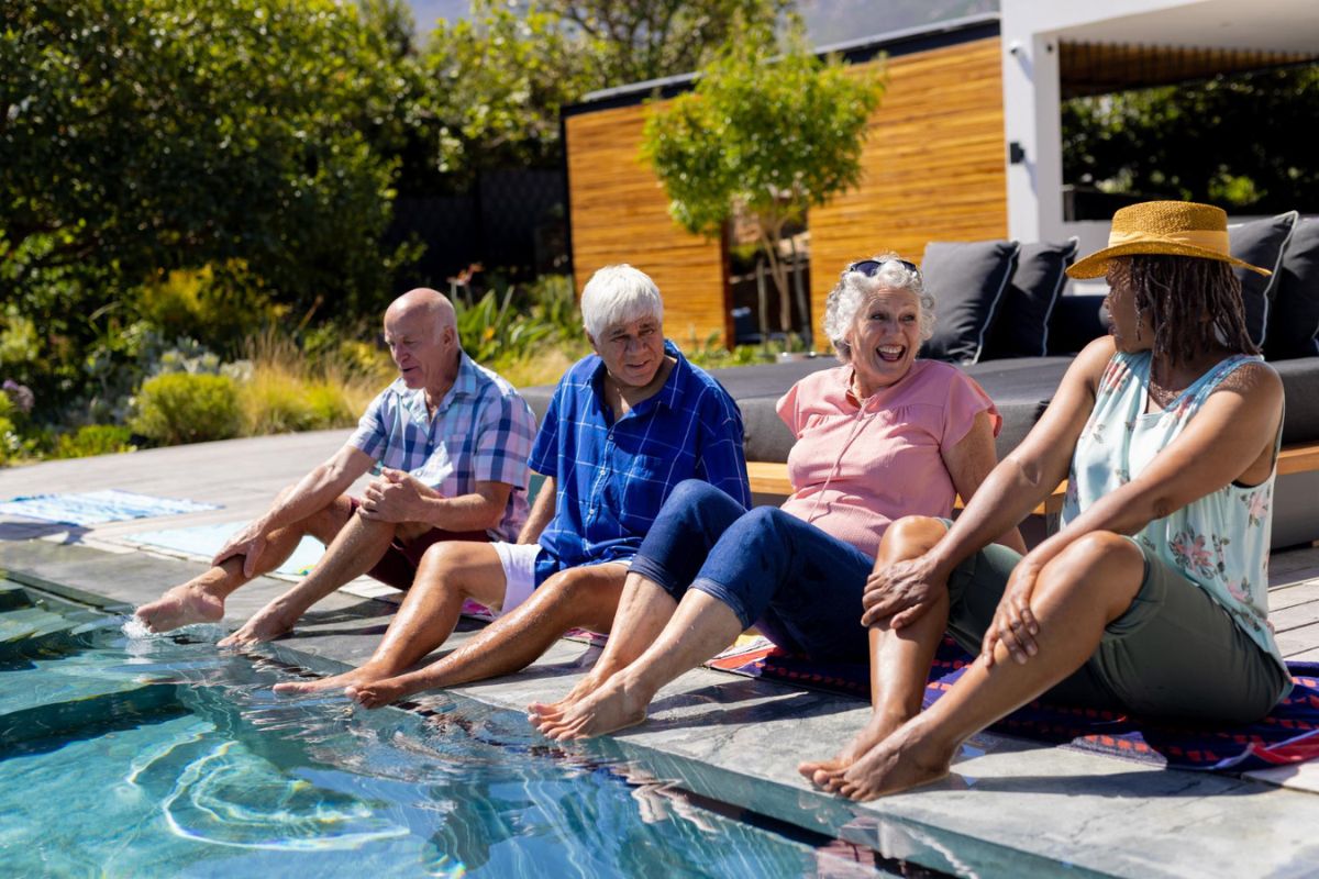 A group of seniors enjoying a resort style amenity - swimming pool