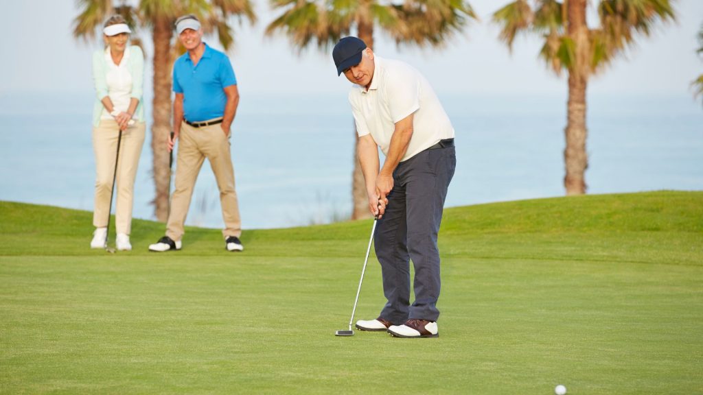 3 seniors playing golf