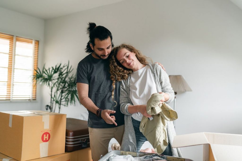 A couple unboxing in their newly rented apartment