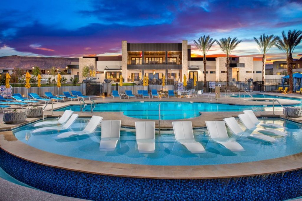 Exterior of Trilogy® in Summerlin with swimming pool and pool chairs