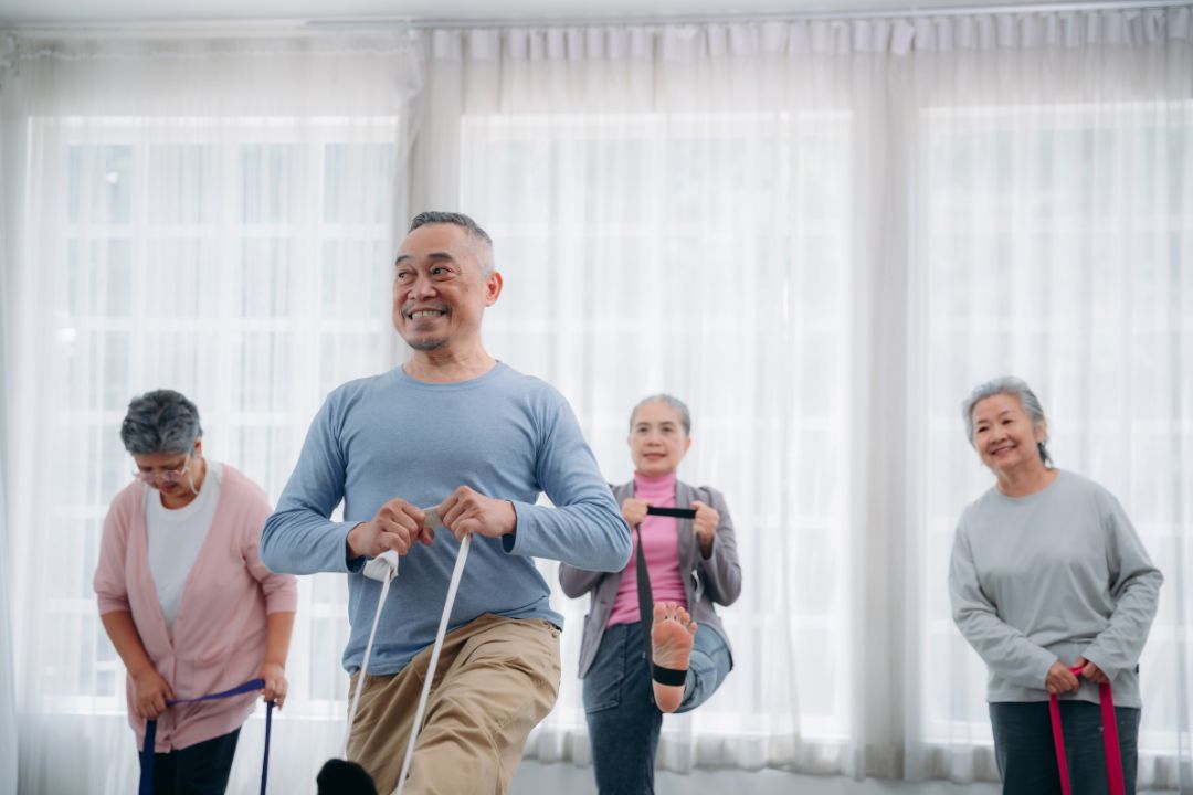 Group of senior Asians exercising