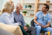 A coyple of seniors having an home visit form a Doctor